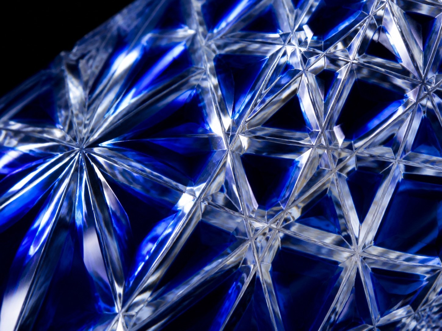 Macro view of the hand-cut facets on a cobalt blue Edo Kiriko glass