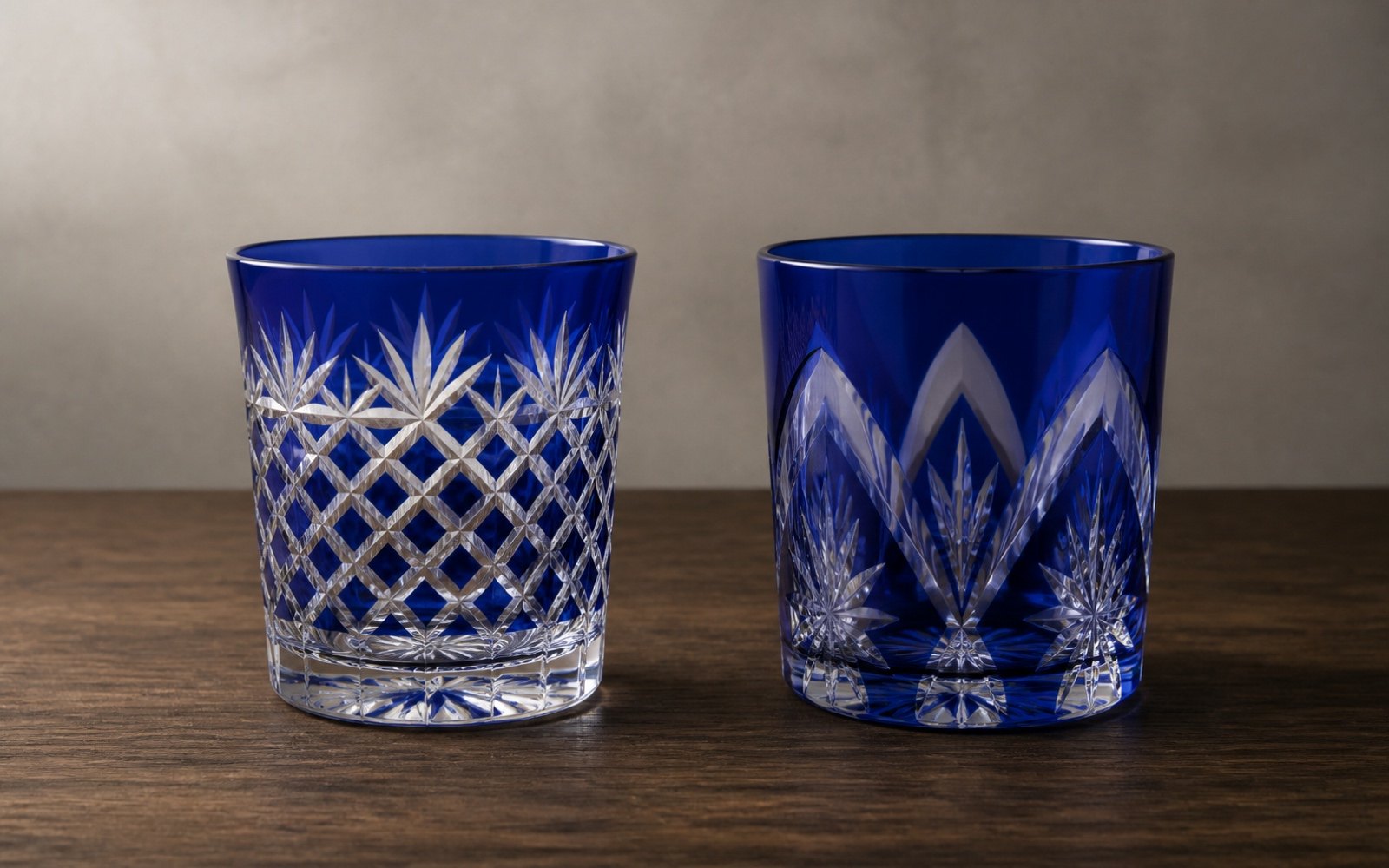 Two cut crystal glasses side by side: one with sharp high-contrast cuts, one with soft colour gradation along each cut